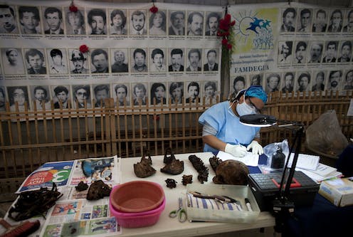 Reading the bones of the dead: the painstaking, painful process of returning genocide victims to their families